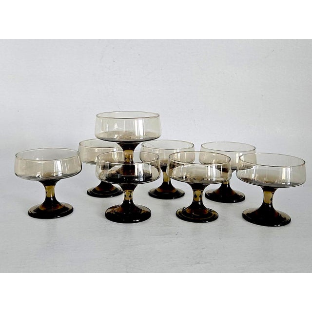 Offered is a set of 8 champagne cups in Tawny Accent by Libbey Glass Company. The color on these cups is a light Smoked...