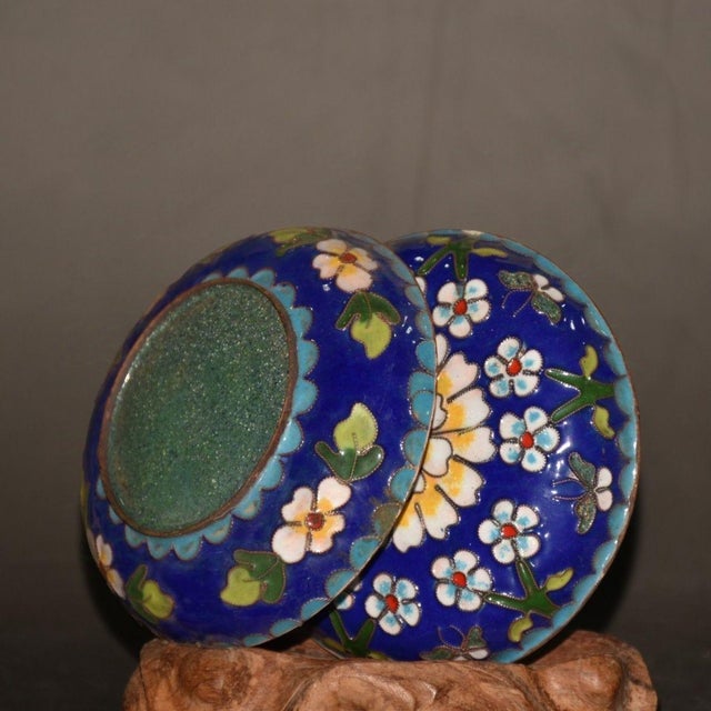 The box features a striking deep cobalt blue ground, beautifully contrasted by a central blooming white peony flower with...