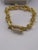 small link gold braclet with cz closure.famous name with matching earings 3" long
