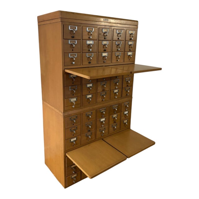 An exceptional authentic Remington Rand Library Bureau Division card catalog cabinet with 60 individual drawers and four...
