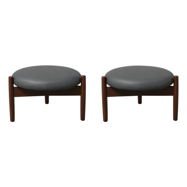 Mid Century Style Round Walnut and Black Leather Ottomans For Sale