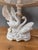 An elegant salon table lamp signed CL Italy, crafted from fine white porcelain. The decorative base features a graceful...