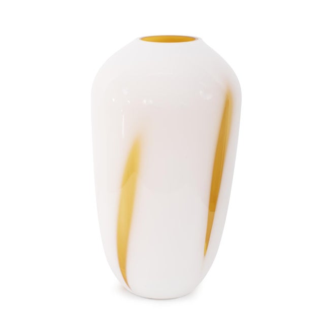 Our Grasberg Glass Vase in white with vibrant orange accents is a dazzling expression of contemporary design and artistic...