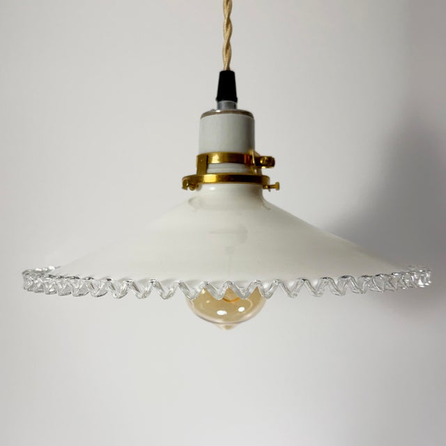 A beautifully hand-blown French white opaline glass pendant light dating to the 1930s. Sourced in Provence, this classic...