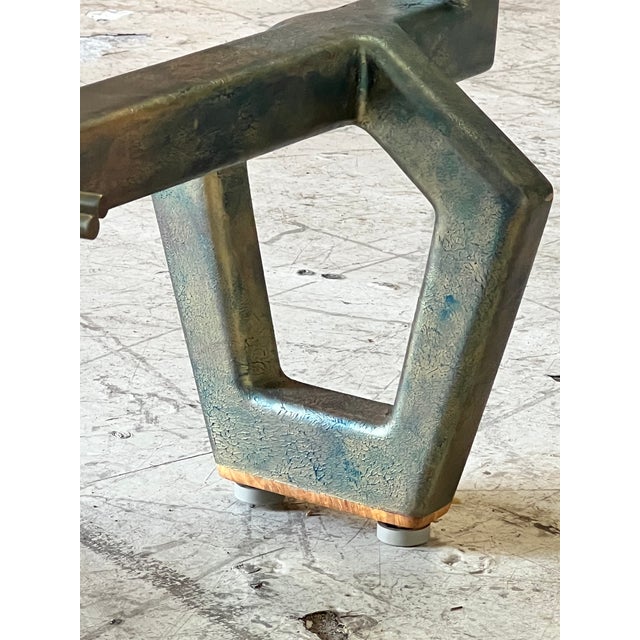 Unique artisan coffee table featuring modernist abstract metal base with a fantastic patina finish. Soft edge triangular...
