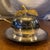 Elegant vintage silverplate serving dish featuring a beautiful Yera apple-and-leaf lid design, clear removable glass...