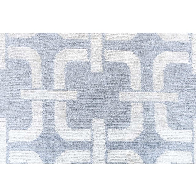 This Modern Deco-Inspired Rug brings together the elegance of Art Deco geometry with the timeless craftsmanship of hand-...