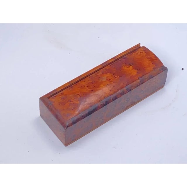 This box has been made in a luminous wood, with beautiful lights. It is in a brown color, and has been made in France...