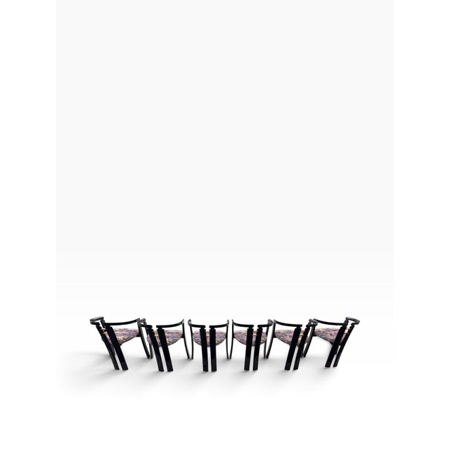 Elevate your dining space with this striking, rare set of six (6) Italian postmodern dining chairs manufactured by PNI in...