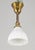 Early 20th century Traditional style pendant light with a fluted milk glass shade and a short brass pole fitter. This...