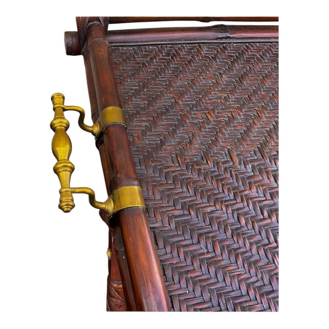 This is a British Colonial style folding tray table or bar by Ralph Lauren. The tray has a faux bamboo frame with brass...