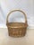 This is a vintage wicker basket with carrying handle. Perfect for a child collecting Easter eggs. Useful in the home as a...