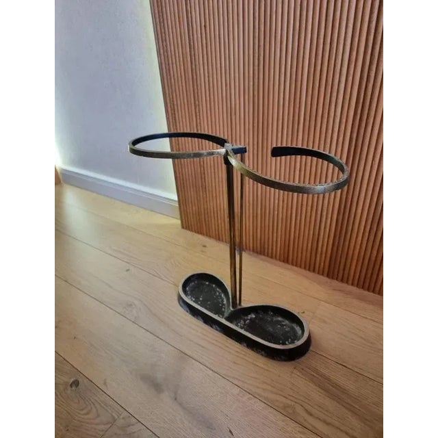 Sculptural modernist / Bauhaus-style umbrella stand in brass and base in aluminium. Attributed to Artes, H. & H. Seefried,...