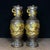 This is a striking pair of vintage Chinese gilt bronze vases, crafted from copper with high-relief decoration and gold...