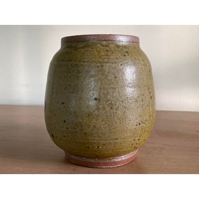 A very cool midcentury stoneware vase with abstract glaze. Indistinctly signed on the base but obviously well potted and...