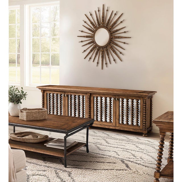 The Entertainment console stands out as a centerpiece, blending rustic warmth with refined style. Made from medium-toned,...