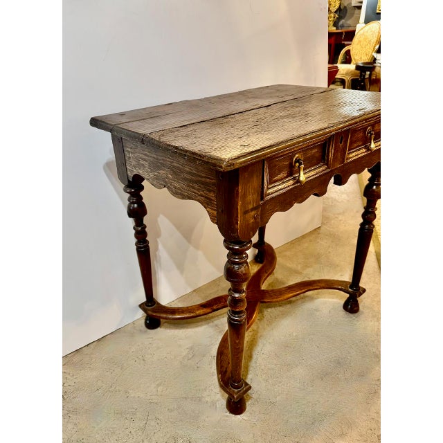 This is a wonderful small period William and Mary Oak Writing Table that dates to c. 1690 - 1700. The table features solid...