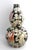Antique Chinese Double-Gourd Porcelain Vase decorated in the Famille Noir palette with vibrant Fencai enamels. The body...