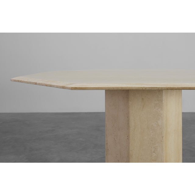 This refined dining table from Italy, crafted in the 1980s, is a celebration of geometric form and natural stone. Made...