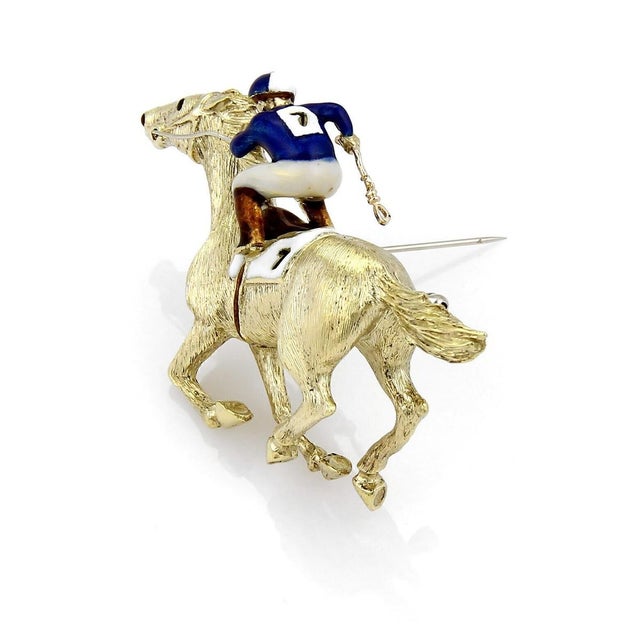 The Martine Enamel Jockey & Race Horse Large 18k Yellow Gold Pin Brooch is a stunning vintage piece that features a unique...