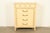 A gorgeous French Regency Louis XVI style highboy dresser By Henredon USA, Circa 1960s Carved cream lacquered walnut, with...
