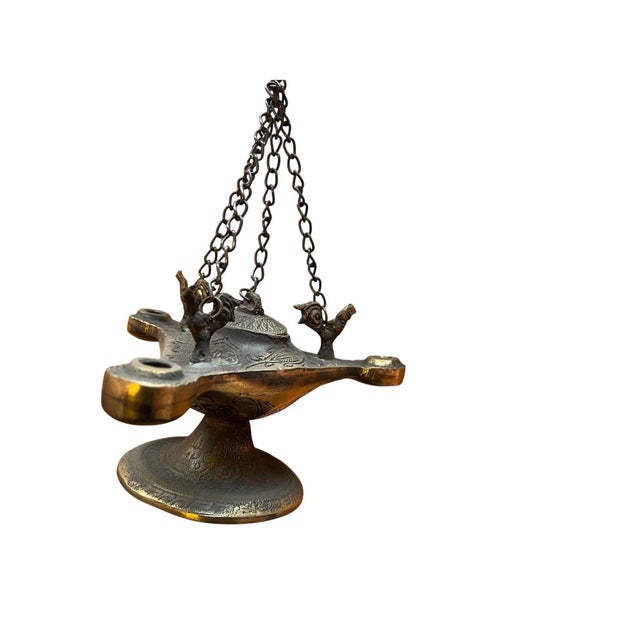Transform your home into a sanctuary with this intricate Brass Hanging Incense Burner. Modeled after ancient oil lamps,...