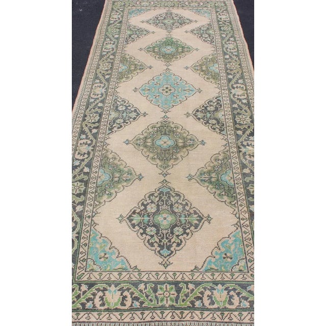Mid 20th Century Turkish Oushak Runner With Medallion Design in Dark Blue, Blush, Aqua and Green For Sale - Image 5 of 12