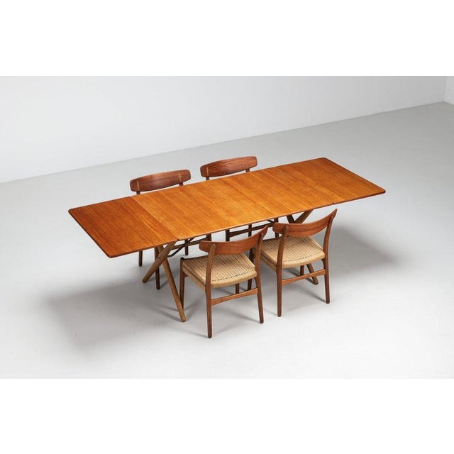 A rare model at-309 dining table designed by hans j. Wegner in 1952 and produced by andreas tuck in denmark. Combining a...