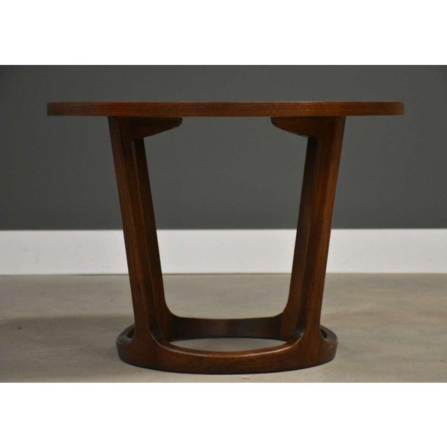 A mid century modern walnut round end table by Lane Rhythm. Made in USA. Circa 1960’s. Professionally refinished. 28”...