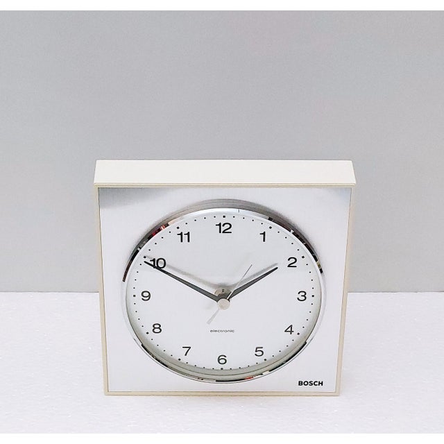 Bosch electronic wall clock made of thicker plastic in germany in the 70s. Electromechanical mechanism with battery drive,...