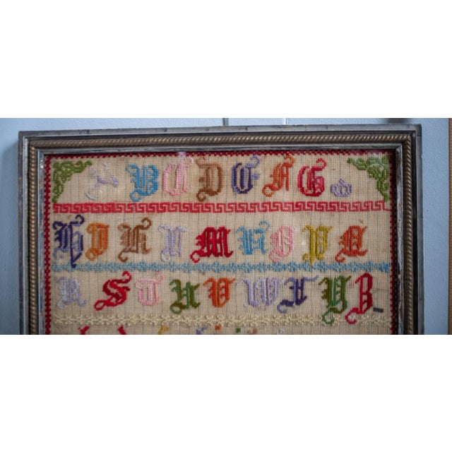 A lovely undated antique letter sampler unsigned, but with an interesting asian chinoiserie theme running through the...