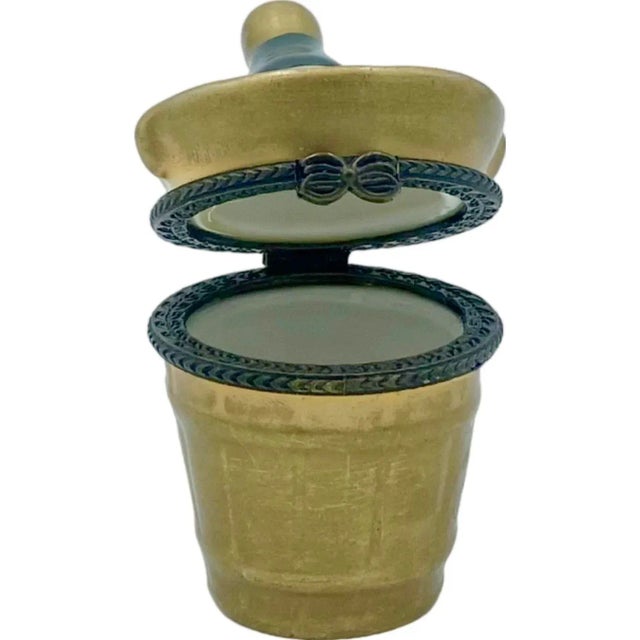 Details: -Box is shaped like an ice bucket with champagne bottle, hinged, and made of painted ceramic/porcelain -Brand is...