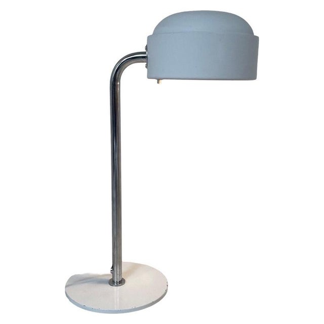Swedish made desk lamp. White painted metal shade and base that are connected with a chromed upright. This lamp has a...