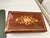 Beautiful large footed wooden box. Lid is beautifully inlaid with foliage floral decor. In excellent condition and no...