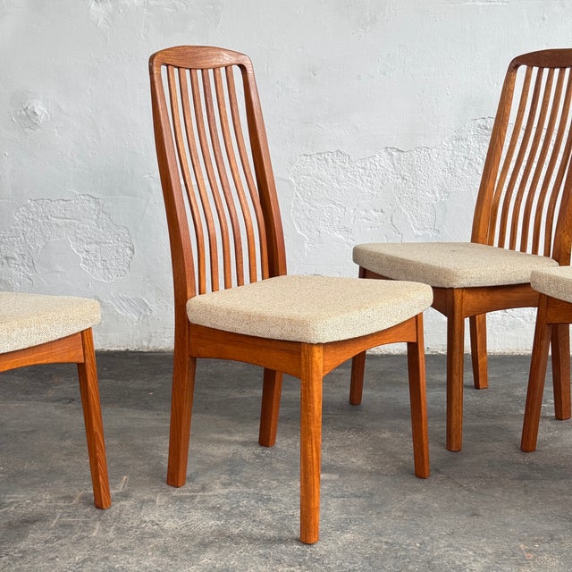 This set of six dining chairs, including two carver armchairs, is a classic example of danish mid-century design. The...
