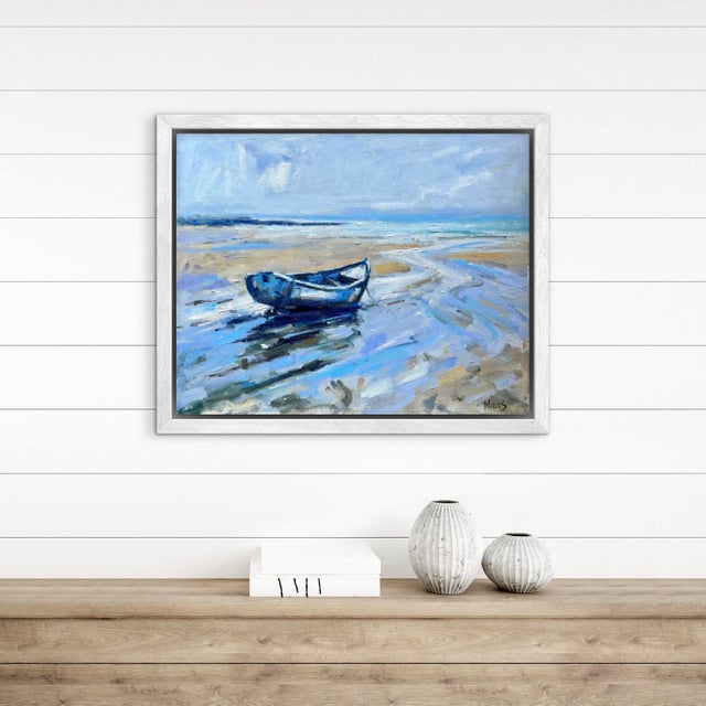 A solitary blue fishing boat rests peacefully on the sand as the tide slowly recedes across a quiet shoreline. Painted...