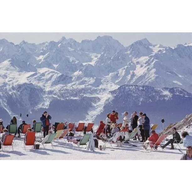 Holidaymakers in sun loungers on the slopes at Verbier, Switzerland, February 1964. Print Measurements : 60"x40" C Type...