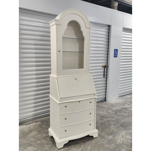 Mid Century John Widdicomb white painted slant front secretary desk with hutch and storage drawers. Featuring the...