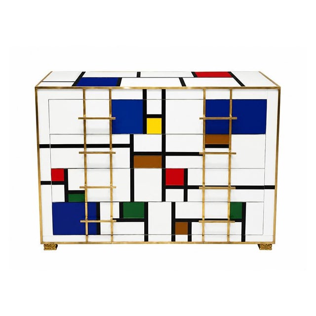 A four-drawer dresser, entirely handmade, with a wooden frame covered in multicolored glass tiles in a mondrian style;...