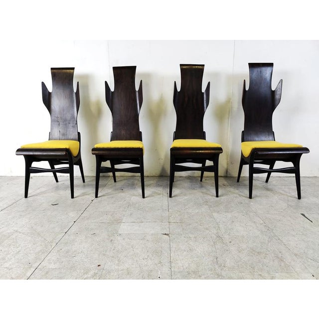 Exceptional mid century 'flame' dining chairs designed by Dante Latorre for Pozzi and Verga. The chairs are made of...