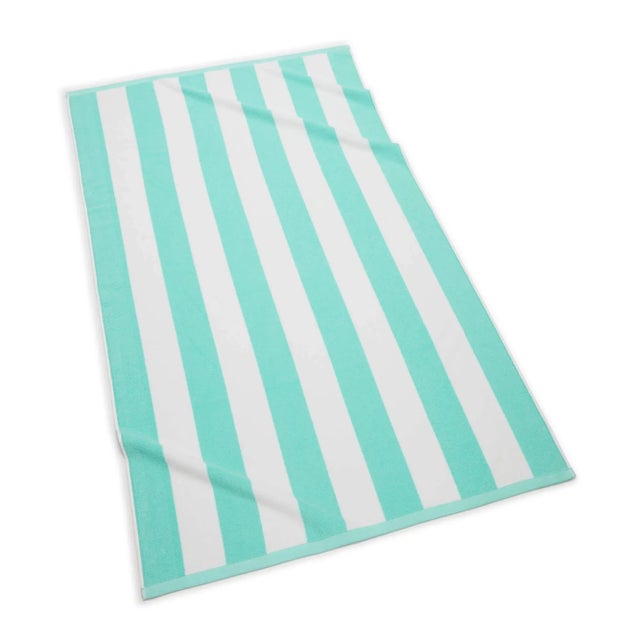 Indulge in the softness of our generously sized Cabana Stripe Beach Towels. Crafted with luxurious 100% long staple...