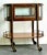 This exquisite vintage Regency bar cart is a masterclass in functional elegance. Featuring a unique vitrine-style top, the...