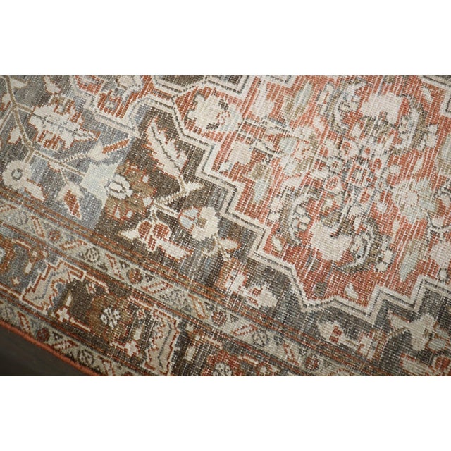 an early 20th Century Persian Heriz Scatter worn Rug