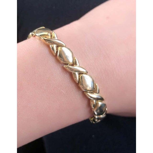 14 Karat Yellow Gold Fancy Link 7 inch Bracelet . 7mm wide 11 grams total weight.