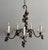Beautiful, antique chandelier consisting of a a scrolled brass frame adorned with glass grape clusters ranging in tones...
