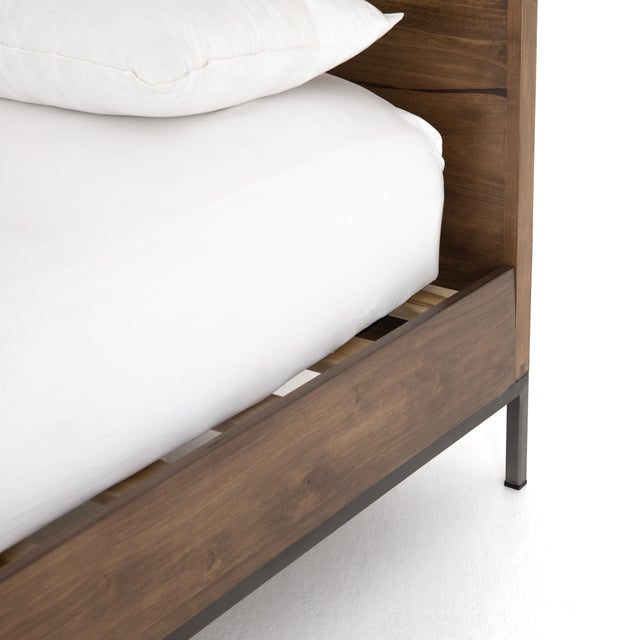 A simply stylish platform bed inspired by clean mid-century design, crafted from auburn-finished poplar for a fashion-...