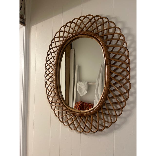 Midcentury beautiful oval wall mirror in bamboo and rattan by Franco Albini. Made in Italy in the 1960s. Details Creator...