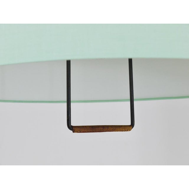 A beautiful midcentury height-adjustable pendant light Kalmar model 2520 with a counterweight, a nice leather-covered...