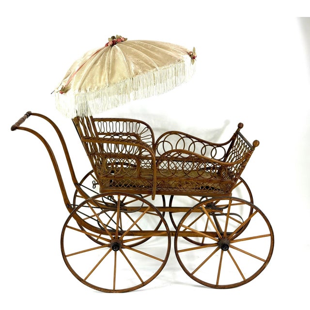 Museum-Quality Late 19th-Century Victorian Wicker Baby Carriage with Original Parasol Step back into the Gilded Age with...