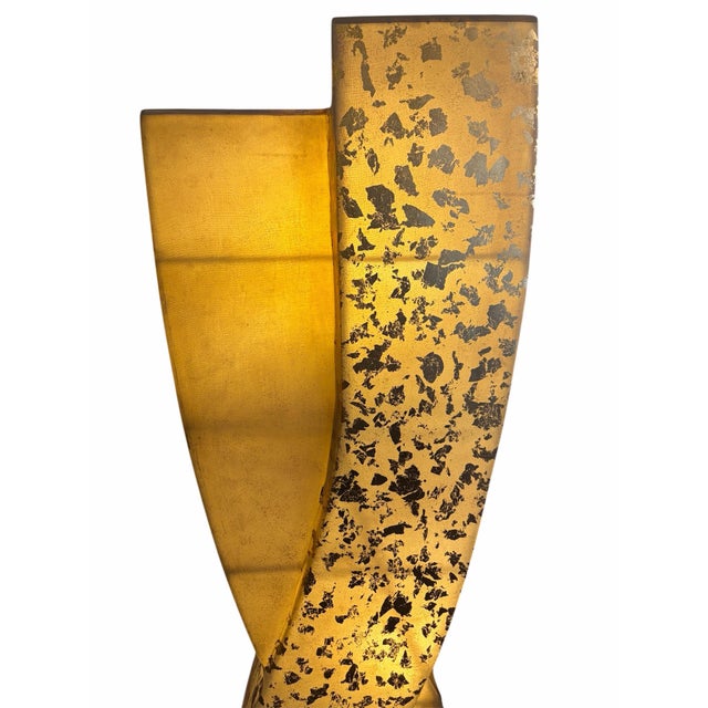 A stunning Mid-Century Modern sculptural double-helix floor lamp, this dynamic piece features translucent amber resin and...